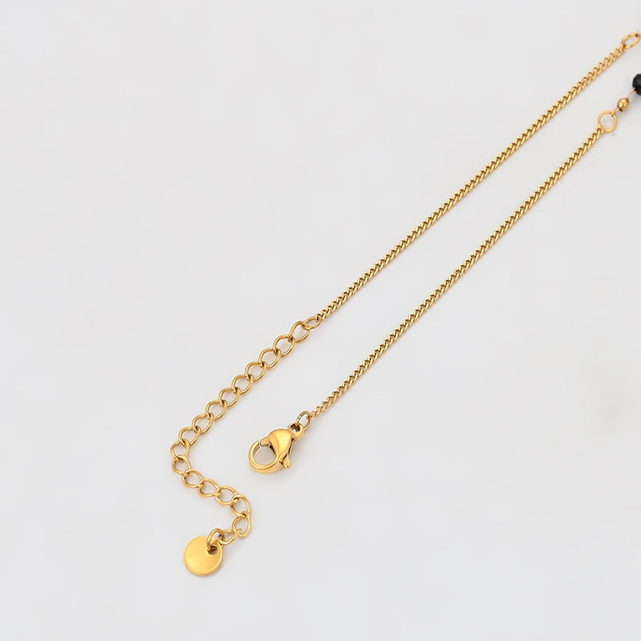 Gold Cross Pendant Necklace with Black Beads